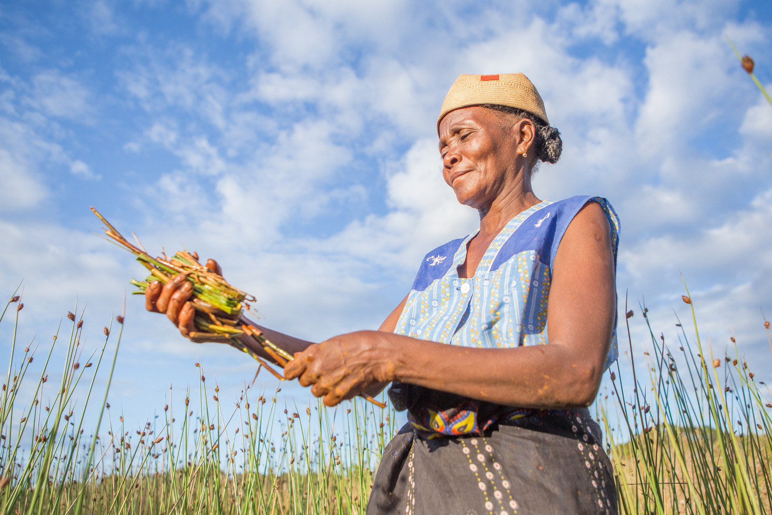 A woman holds some wheat