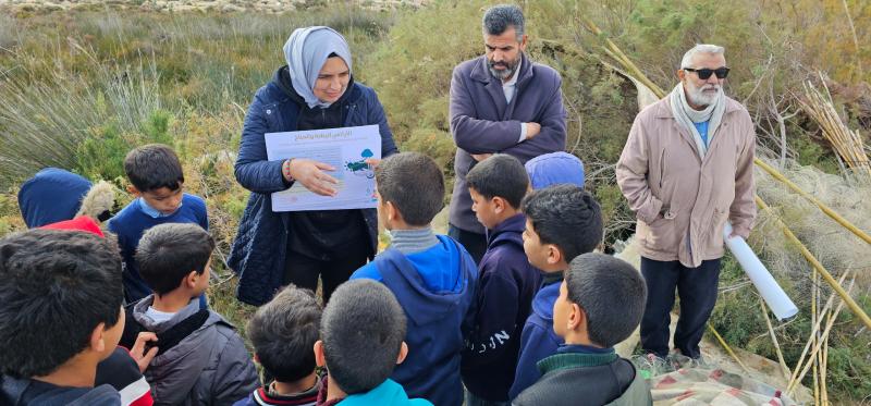 While conducting field work, Sara takes time to enlighten a group of youngsters on why protecting the oceans is important for their future