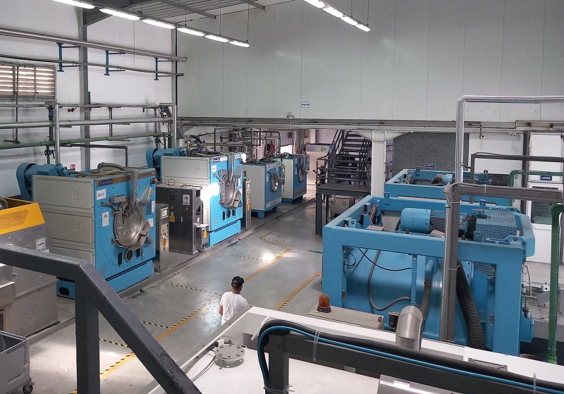 A factory floor with large washing machines&nbsp;