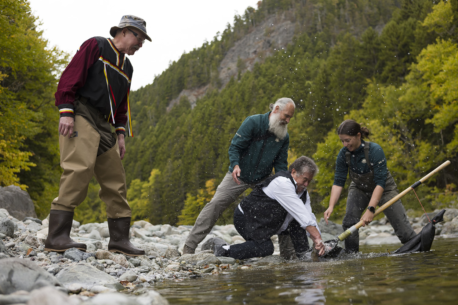 Salmon being released back into Canadas rivers by Indigenous community representatives and scientists (Photo: Todd Brown)
