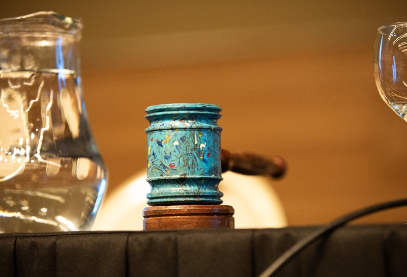 A plastic gavel on a table