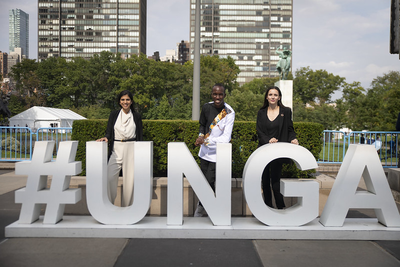 UNEPs Young Champions of the Earth in front of UNGA sign