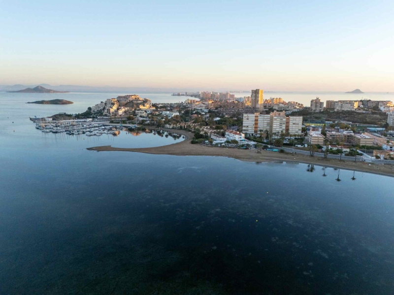 Buildings on strip of land surrounded by water