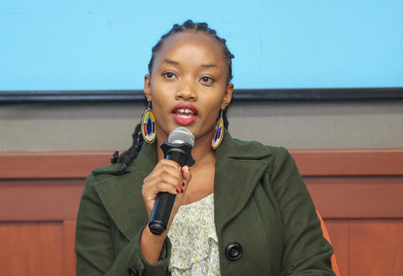 A woman talking on a microphone