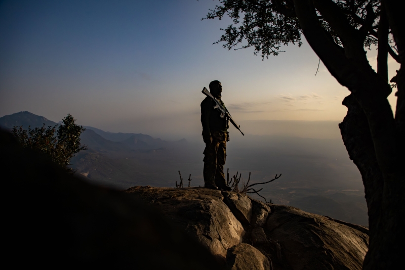 A volunteer community ranger looks out over the landscape. 