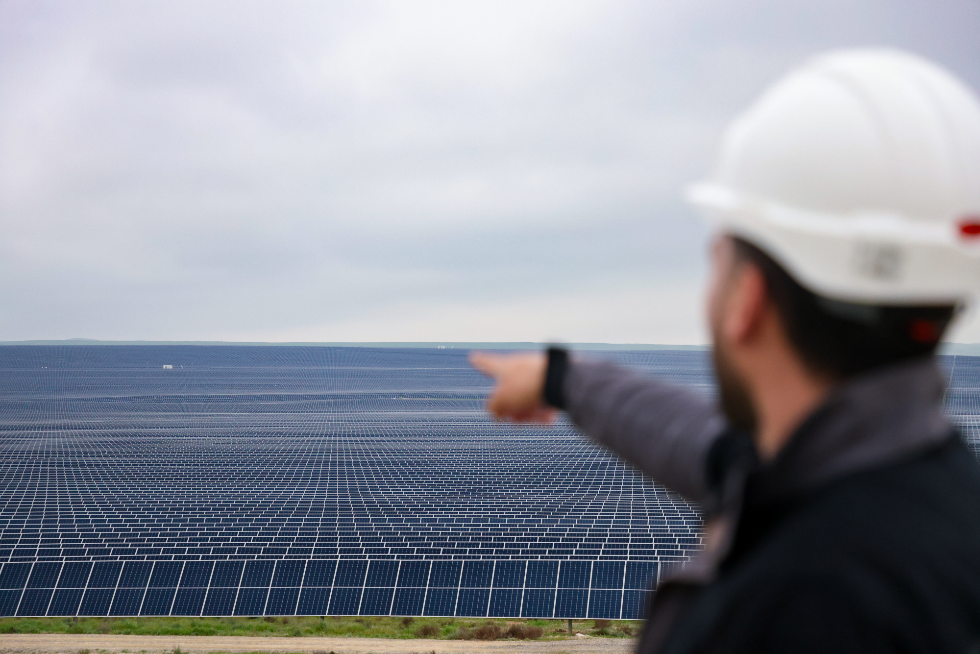 A man pointing at a solar array