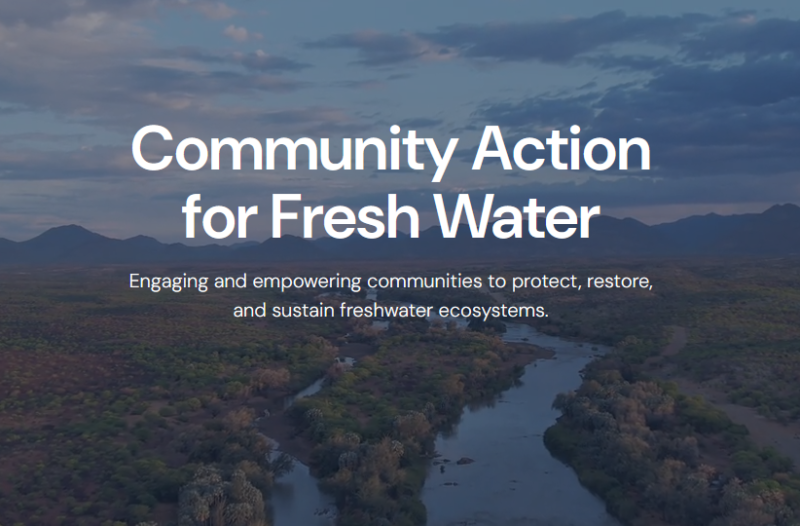 Aerial image of river between trees with text overlay