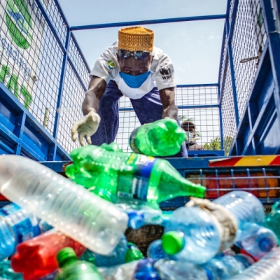 Man removed plastic rubbish from a truck