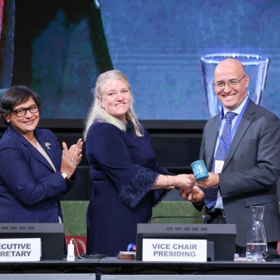 Vice-Chair, Ambassador Johanna Lissinger-Peitz of Sweden hands the gavel to new INC Chair, Ambassador Julio Cordano
