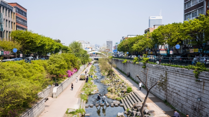 A stream runs through a city