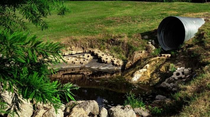 Sewage pipe draining polluted water