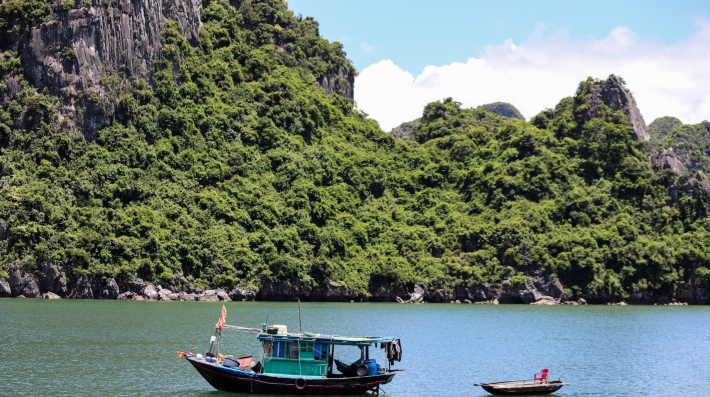 Boats floating on top of a lake
