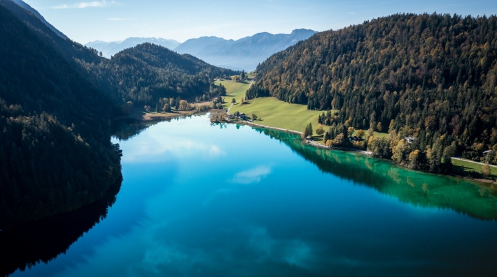 A large body of water surrounded by mountains