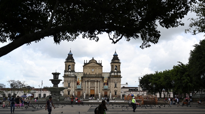 A view of a public square and colonial-era building 