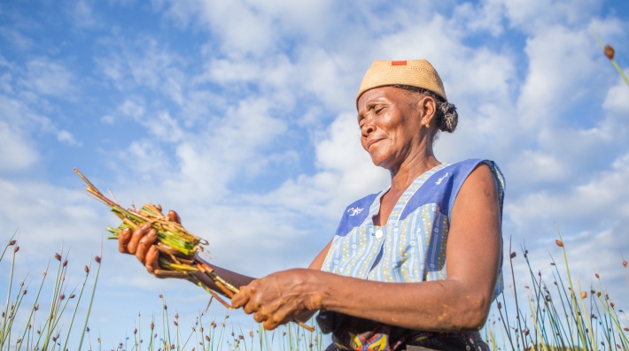 A woman holds some wheat