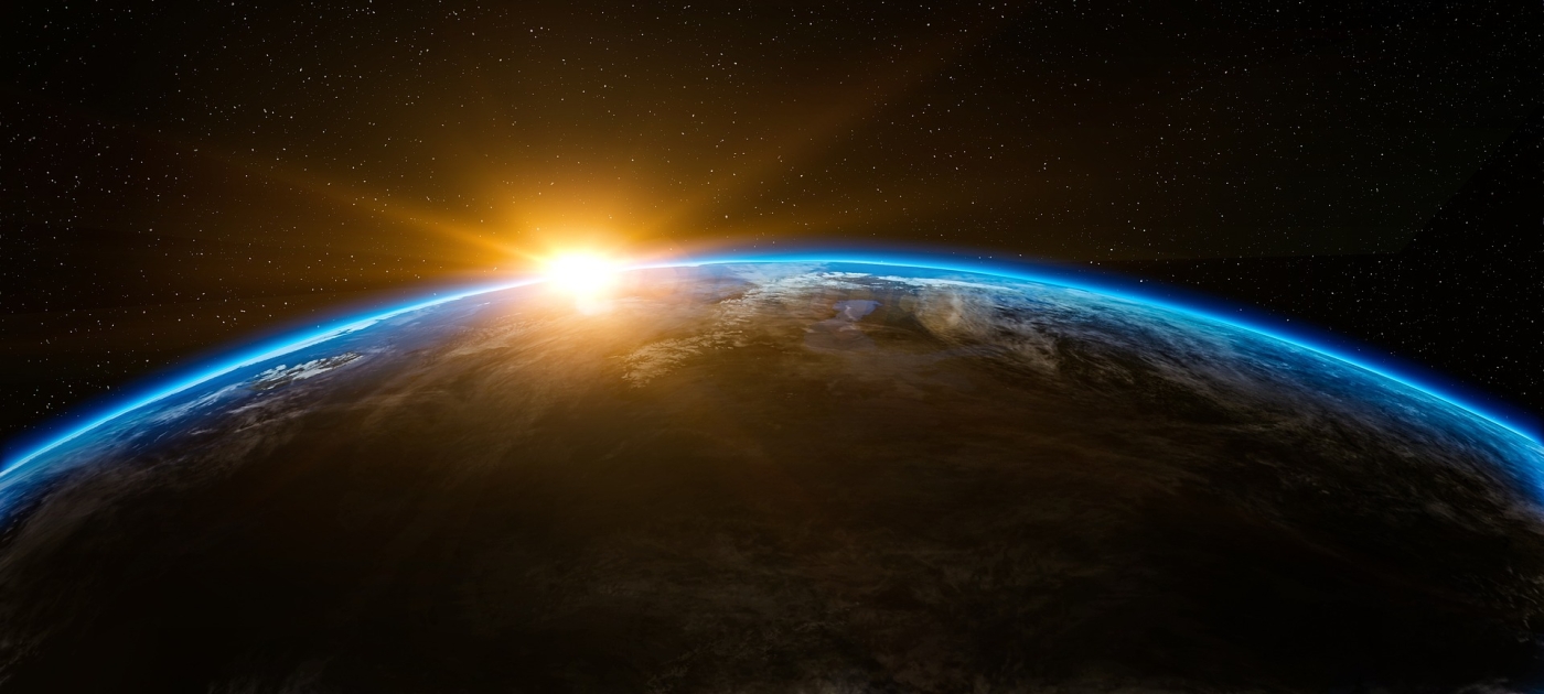 Sun rising over earth