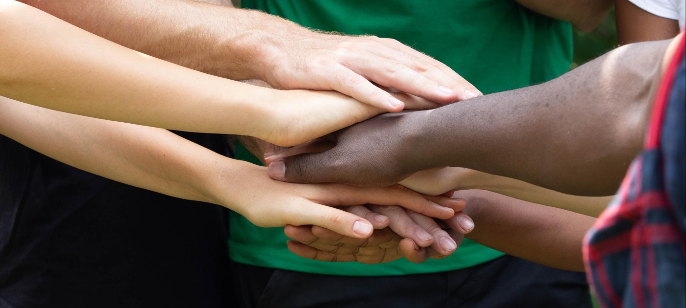 Close Up Of Hand Stack Over Each Other By A Group Of Multi Culture Friends