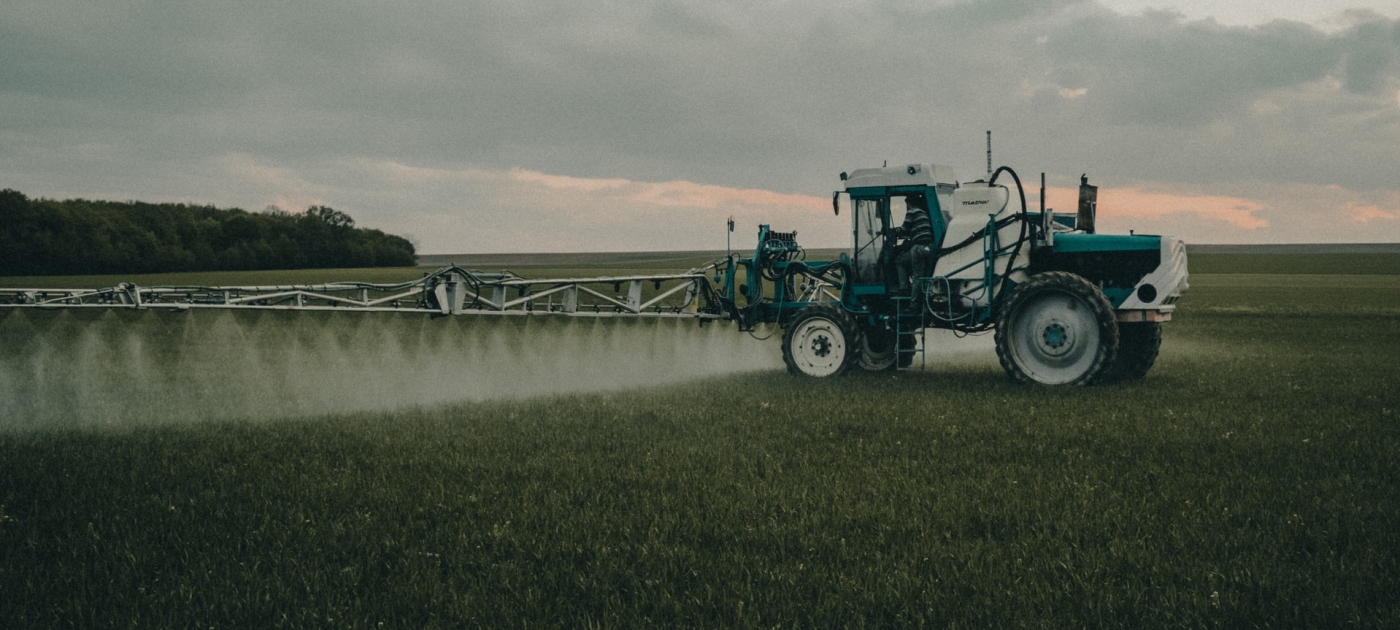 Tractor spraying in a field