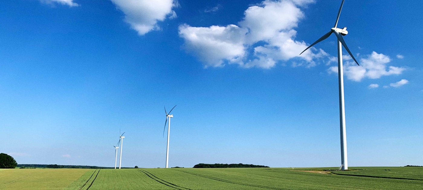 Wind turbines in a green field 