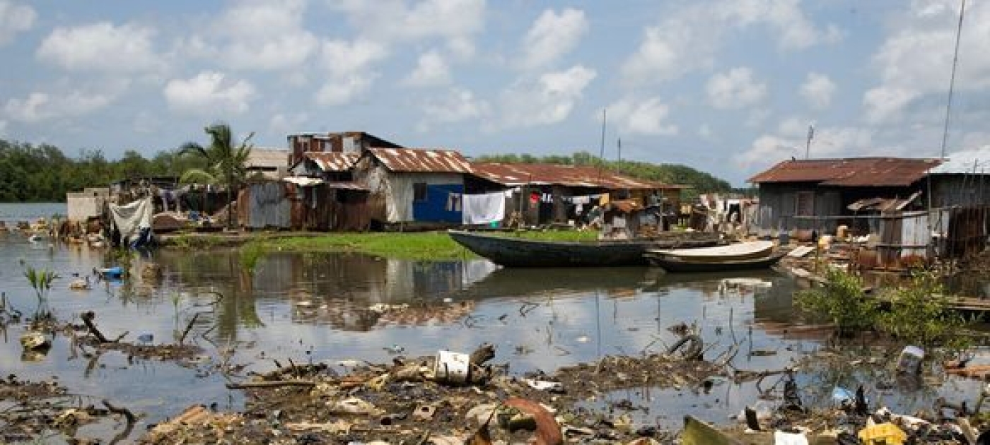 Land-based pollution litters the waters of a fishing village in the Niger Delta of Nigeria