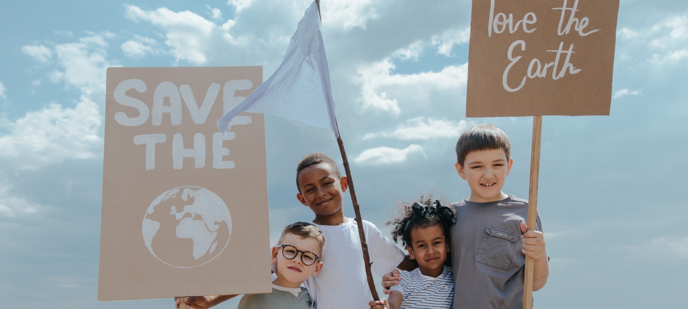 Children Standing Together while Holding Signages