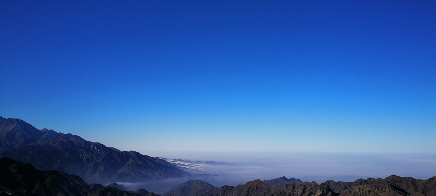 Gray rock formation under blue sky