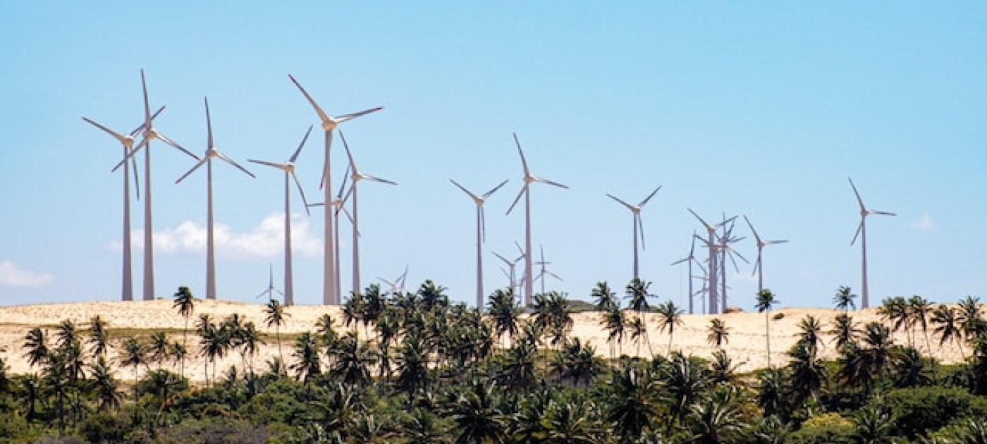 Wind turbines in green grass field, State of Ceará, Brazil