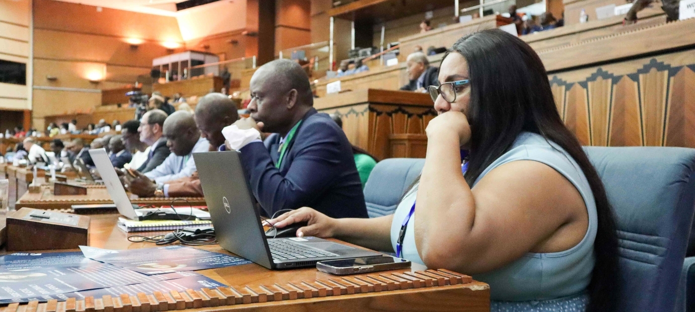 People at a meeting using their laptops