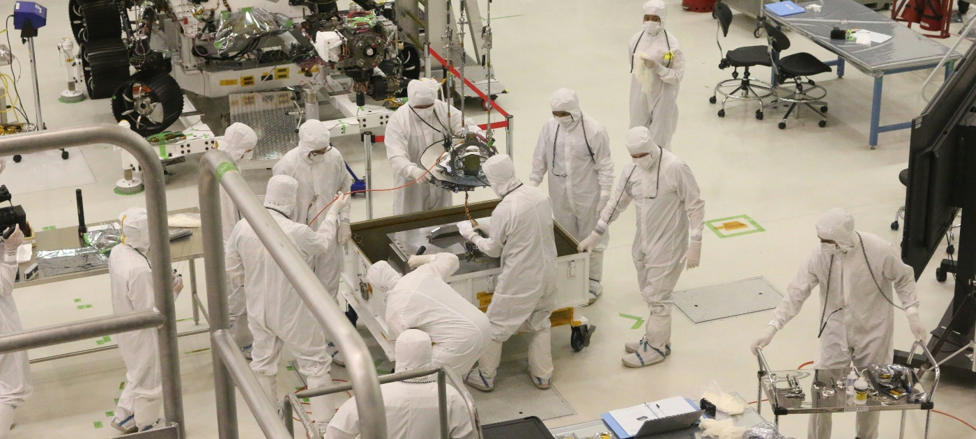 men in white gi in industrial setting