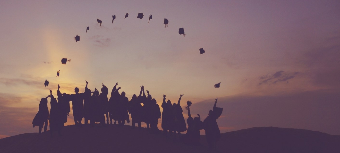 Silhouette of people standing on hill