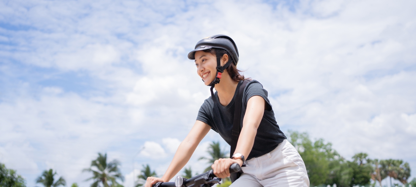 Asian university students riding bicycles