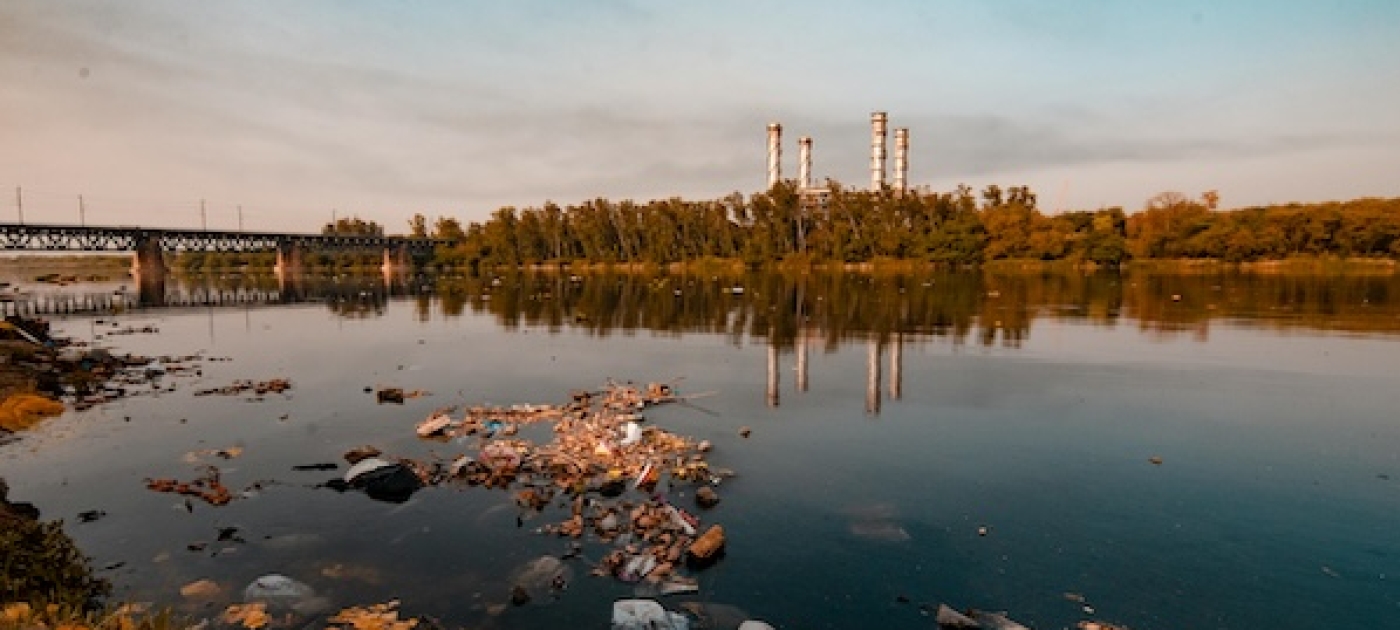 polluted river with background factory