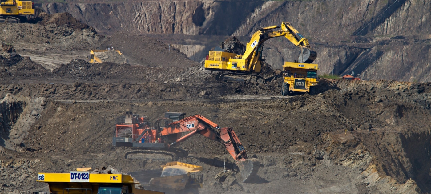 Photography of excavators at a mining area