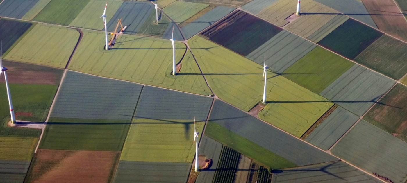 Windmills in field