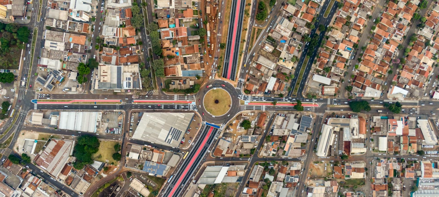 Drone shot of a roundabout and houses in a city 
