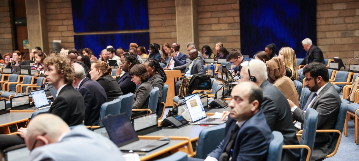 Delegates sitting down, listening to a speaker during the 11th ASC