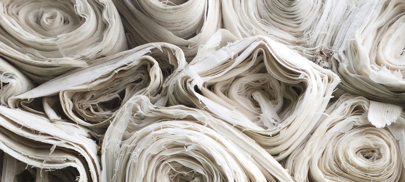 Rolls of white stacked high