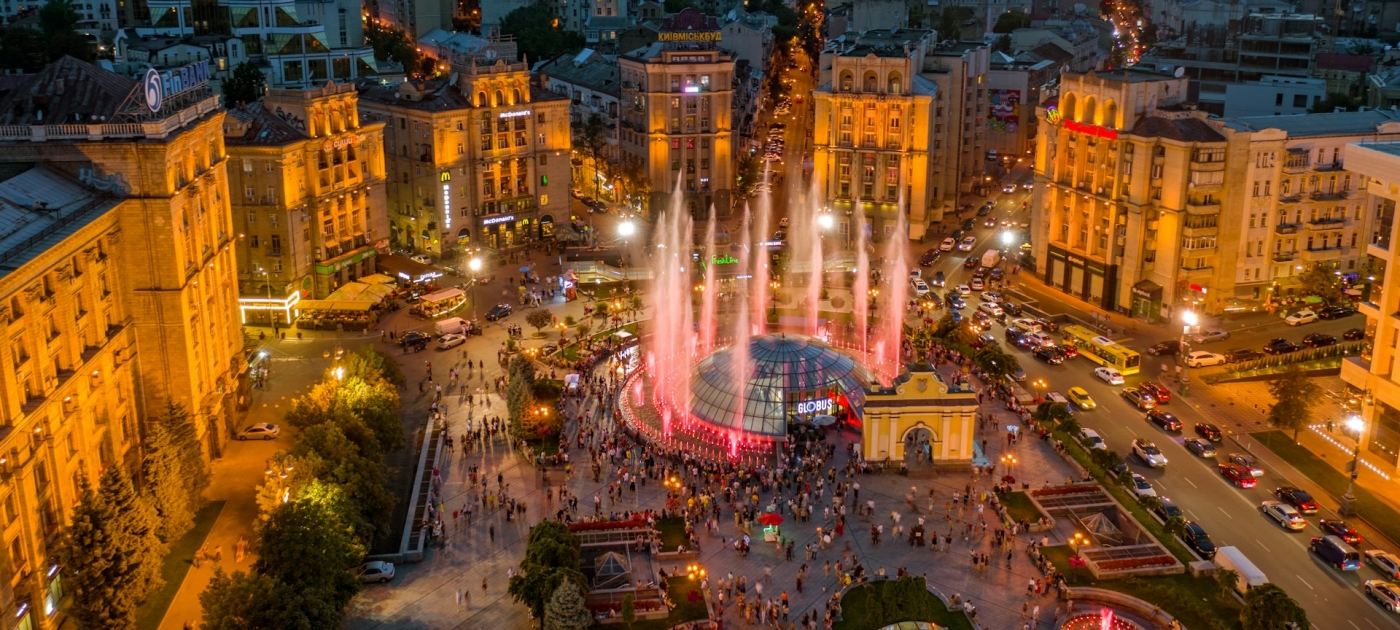 City with lights turned on during night time