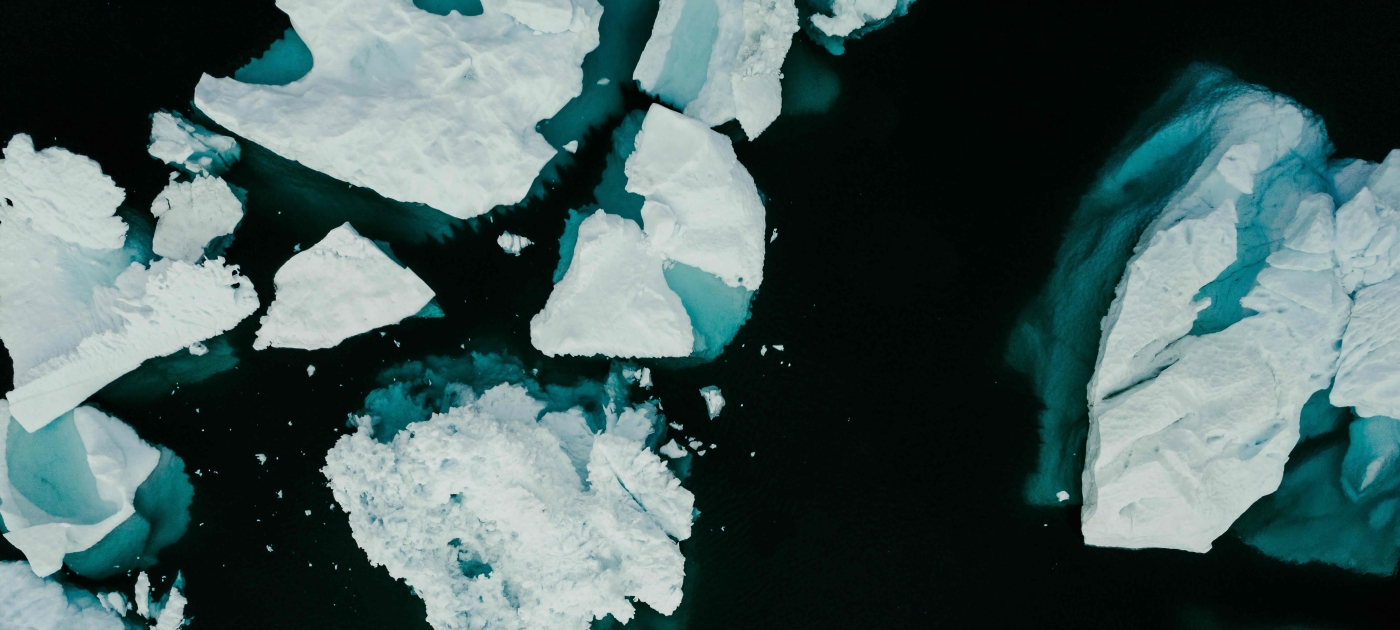 Group of floating icebergs on water