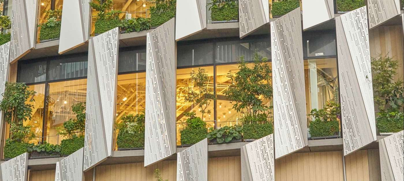 Tall building with green windows and LED lighting