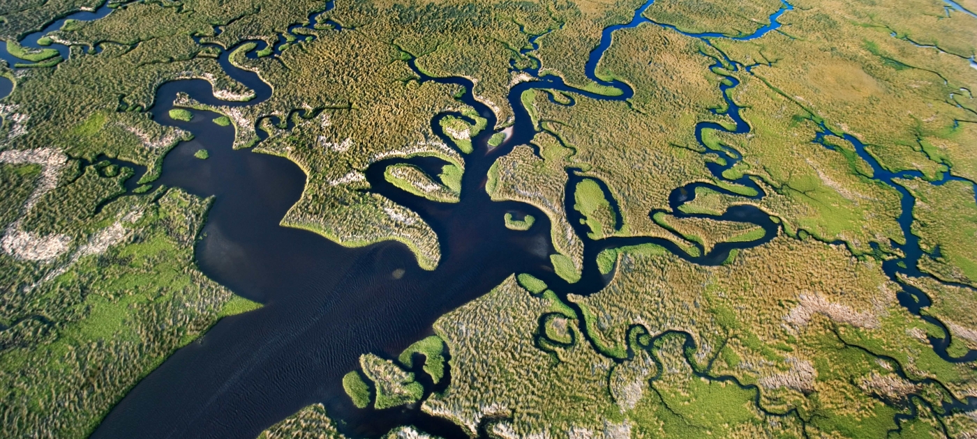 A large of water surrounded by land 