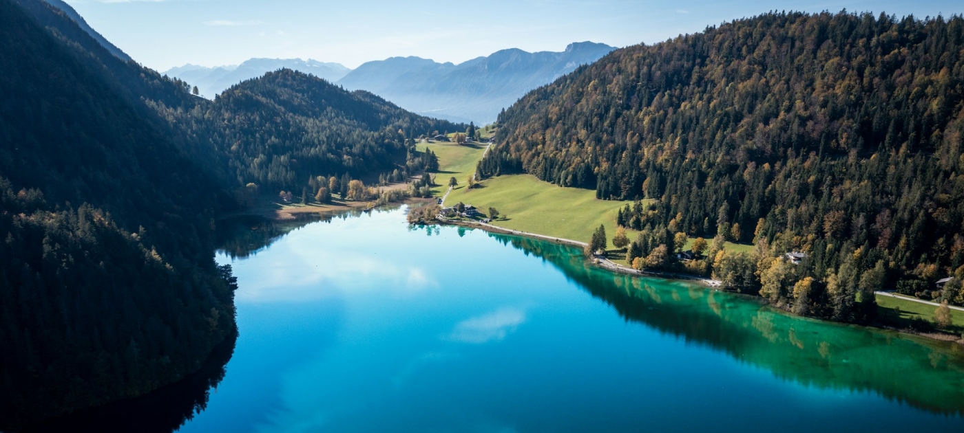 A large body of water surrounded by mountains