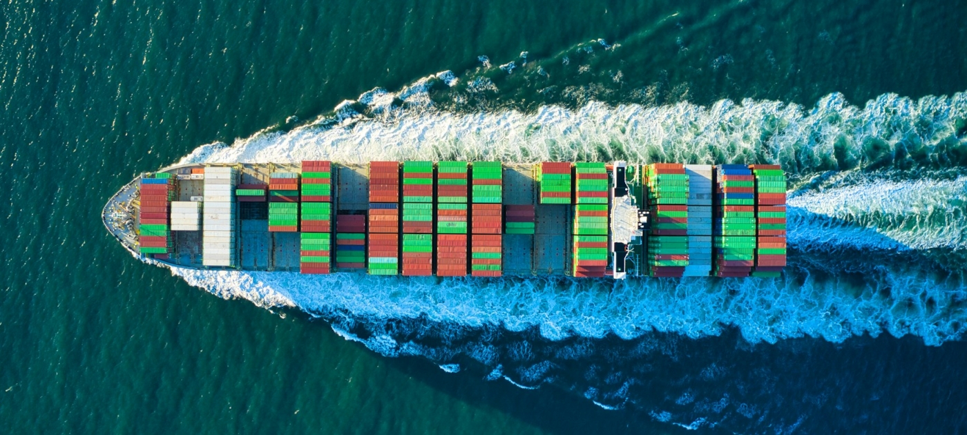 Aerial view of a cargo ship on body of water during daytime