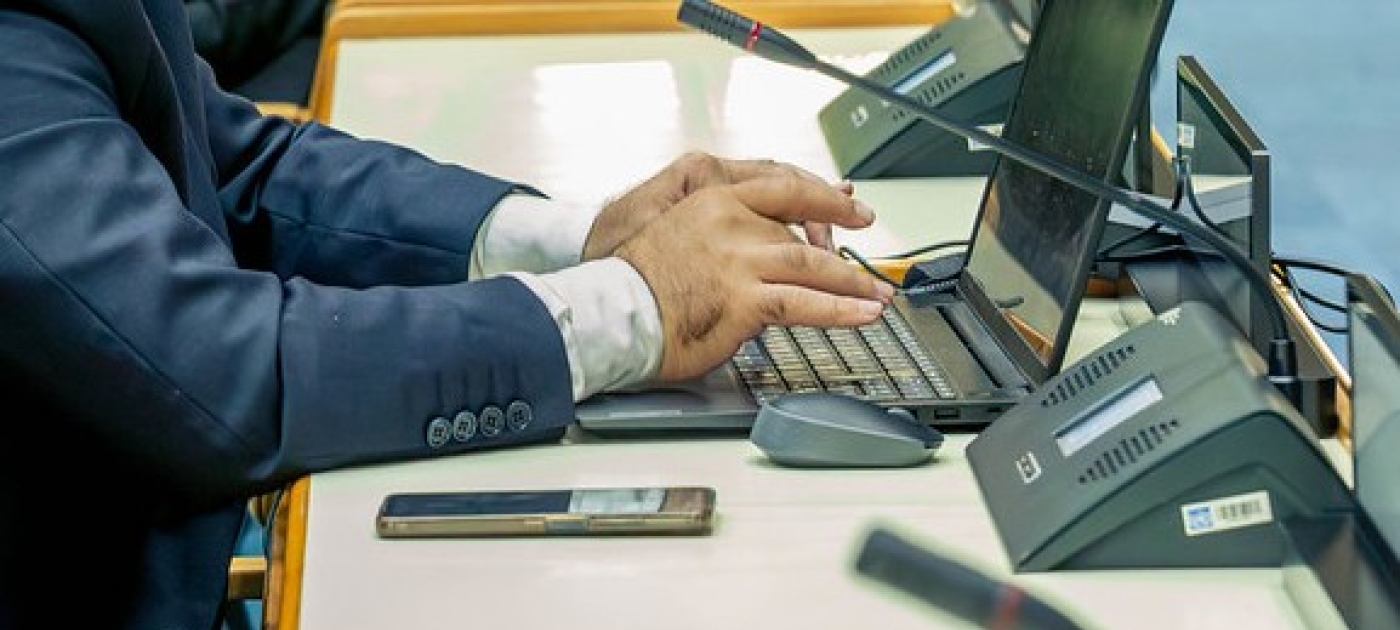 Delegate typing on a laptop