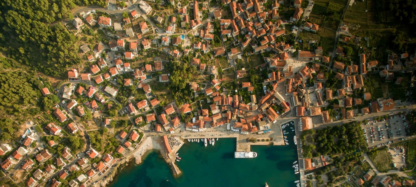 Aerial photo of body of water and city