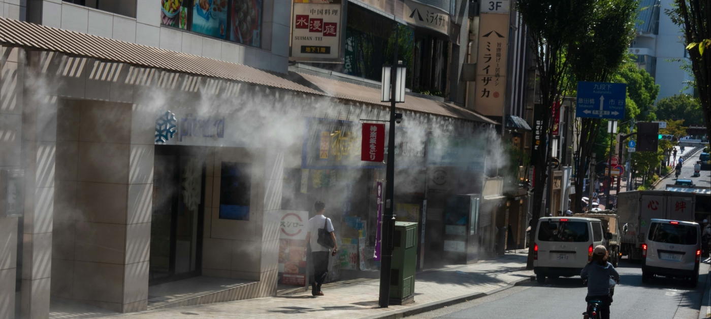 Photo on street with water jets to cool down