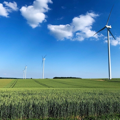 Wind turbines in a green field 