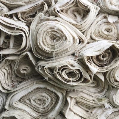 Rolls of white stacked high