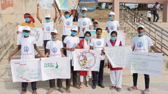 A group of students holding signs.