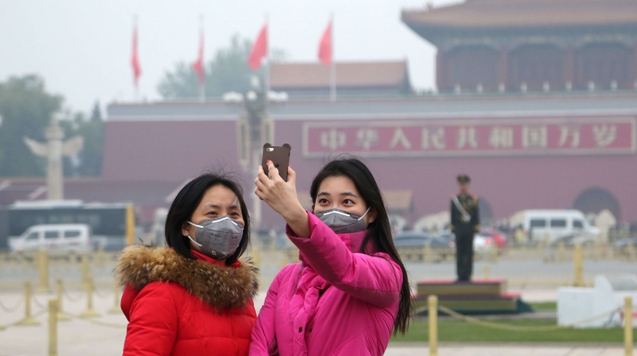 Two women pose for a photo in Beijing 